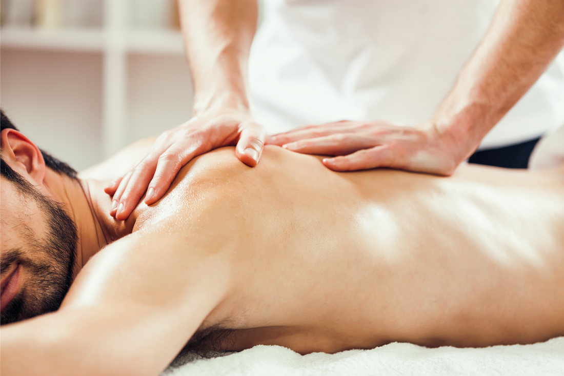 Young man is enjoying massage on spa treatment.