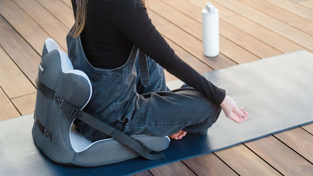 yoga meditation with lumbar support cushion back pain meditation lady doing yoga sitting on the floor