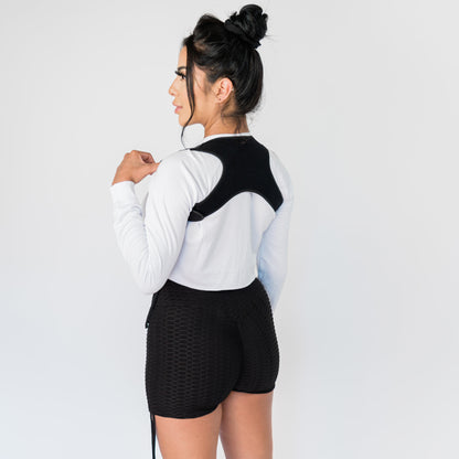 Woman wearing the Up-Mid Back Posture Corrector